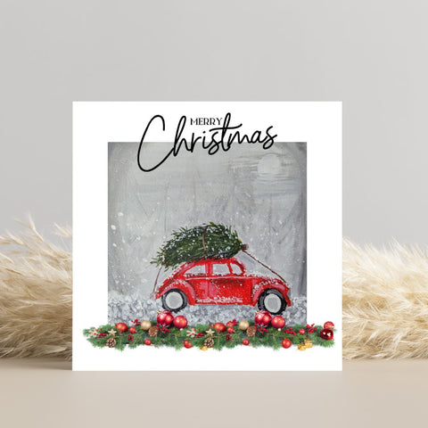 Christmas Card -  coming home for christmas vw beetle and tree in snow